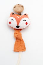 Attache-tétine en tissu orange avec visage de renard et clip en bois