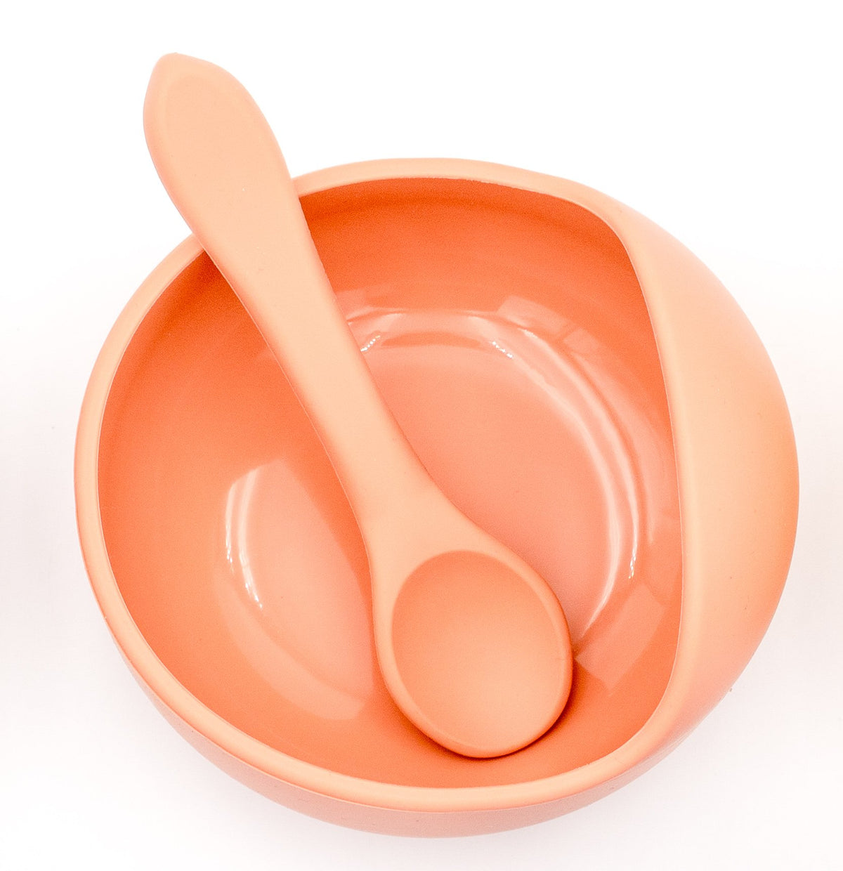 Vue du dessus du bol couleur argile avec cuillère en silicone
