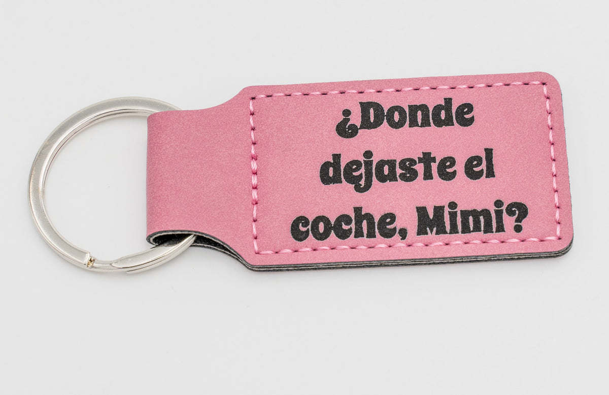 Porte-clé rectangulaire rose avec question sur les clés de voiture.