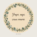Aperçu numérique : pancarte ronde avec eucalyptus et fleurs, texte «Papá, aquí viene mamá» et deux trous supérieurs.