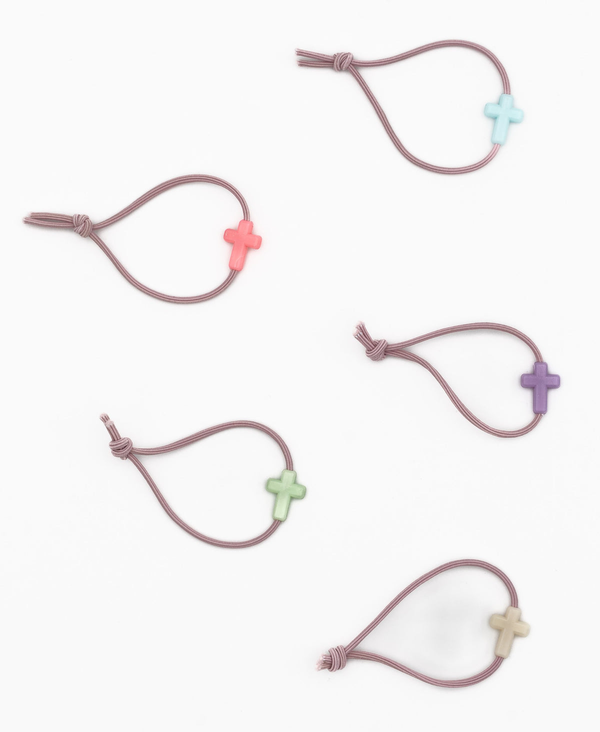 Cinq bracelets élastiques mauves avec croix en silicone de différentes teintes