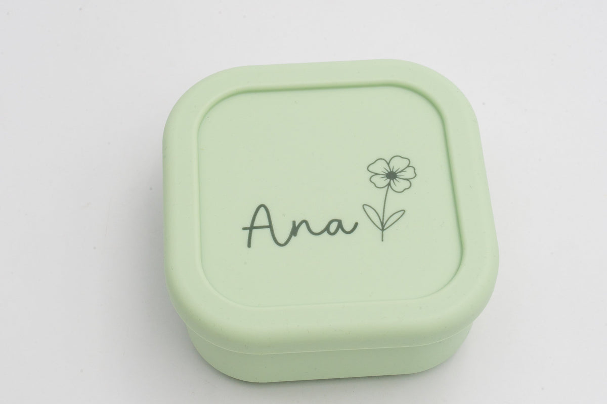 Tupper verde claro personalizado con nombre Ana y una flor